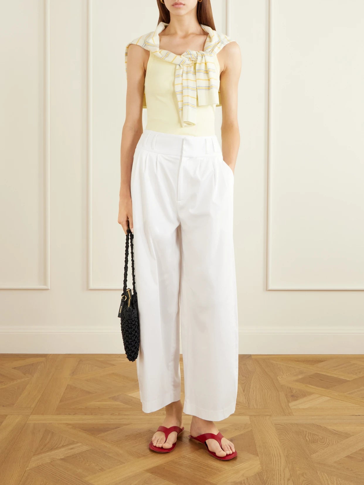 Image of a model wearing Tops. Product name - May Organic Cotton-jersey Tank in Pastel yellow colour by brand - FLORE FLORE