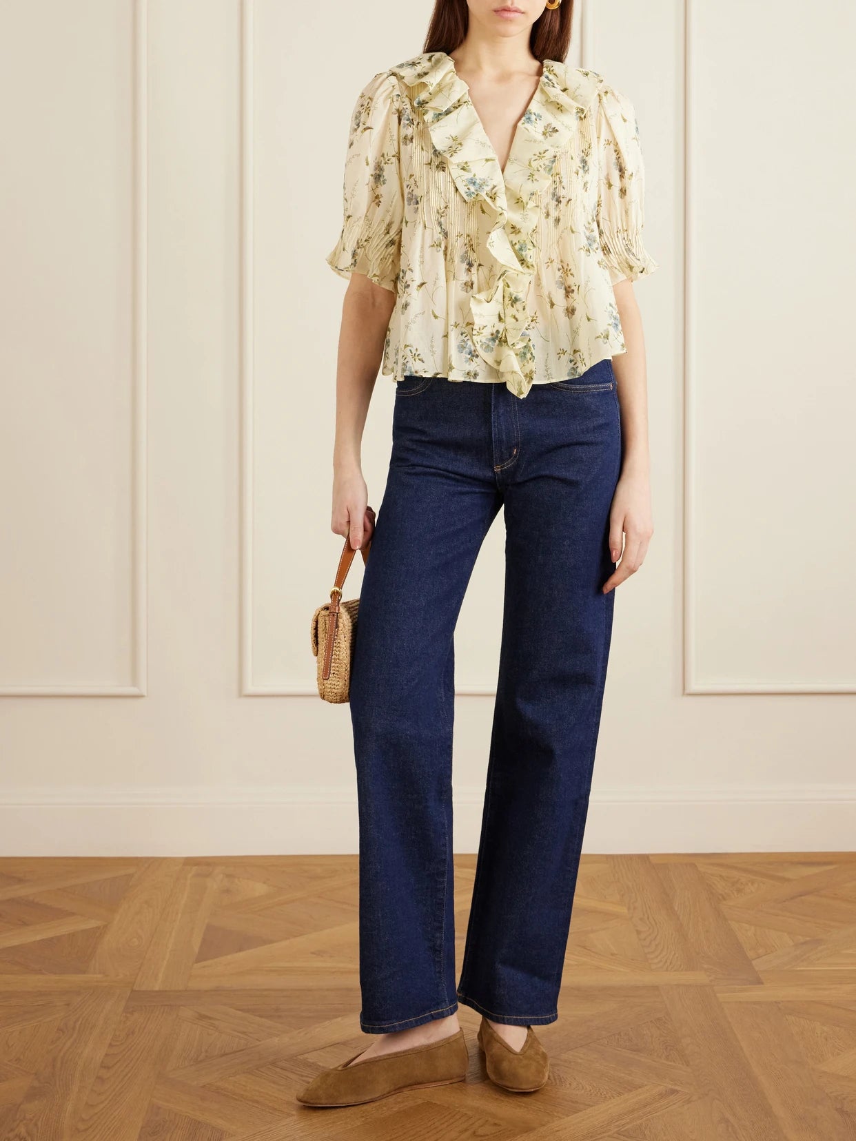 Image of a model wearing Tops. Product name - Henri Ruffled Pintucked Organic Cotton-voile Top in Pastel yellow colour by brand - DÔEN