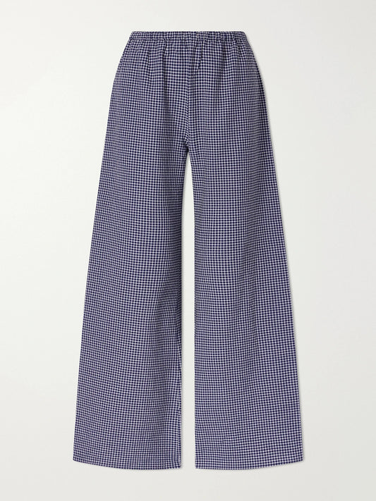 Image of a model wearing Pants. Product name - Freya Checked Cotton-blend Wide-leg Pants in Blue colour by brand - La Ligne