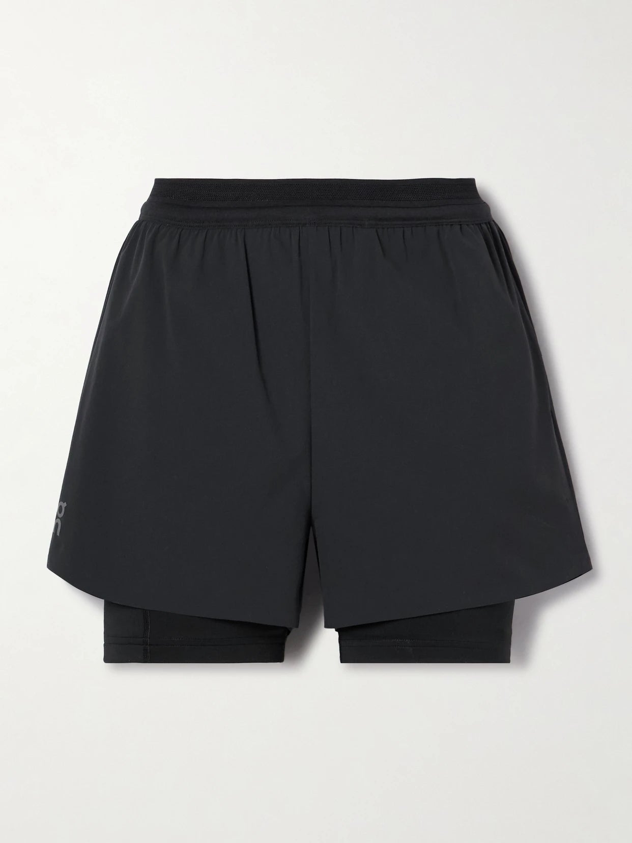 Image of a model wearing Shorts. Product name - Pace Layered Recycled-shell And Stretch-jersey Shorts in Black colour by brand - ON