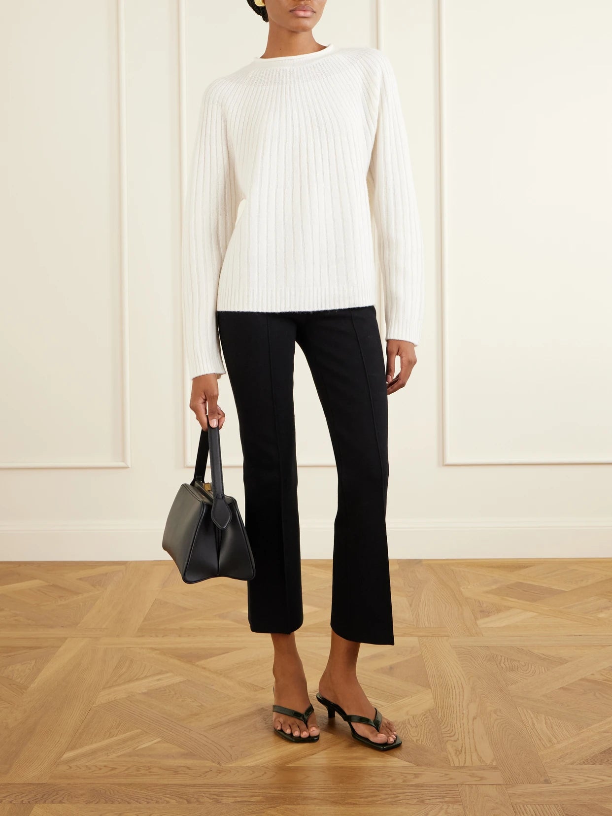 Image of a model wearing Outerwear. Product name - Scallop Ribbed-knit Cashmere Sweater in Ivory colour by brand - La Ligne