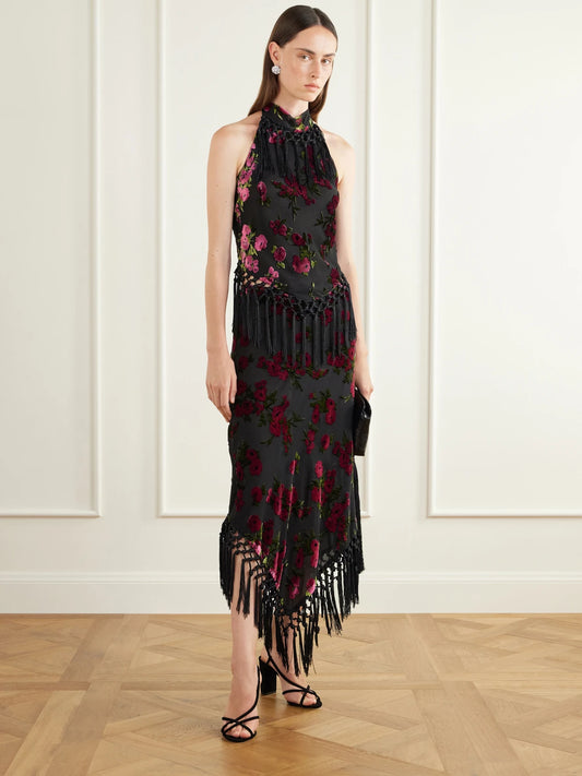 Image of a model wearing Skirts. Product name - Asymmetric Floral-flock Fringe-trimmed Crepe Midi Skirt in Multi colour by brand - Anna Sui