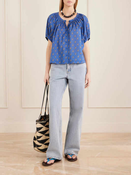 Image of a model wearing Tops. Product name - June Floral-printed Cotton Top in Blue colour by brand - DÔEN