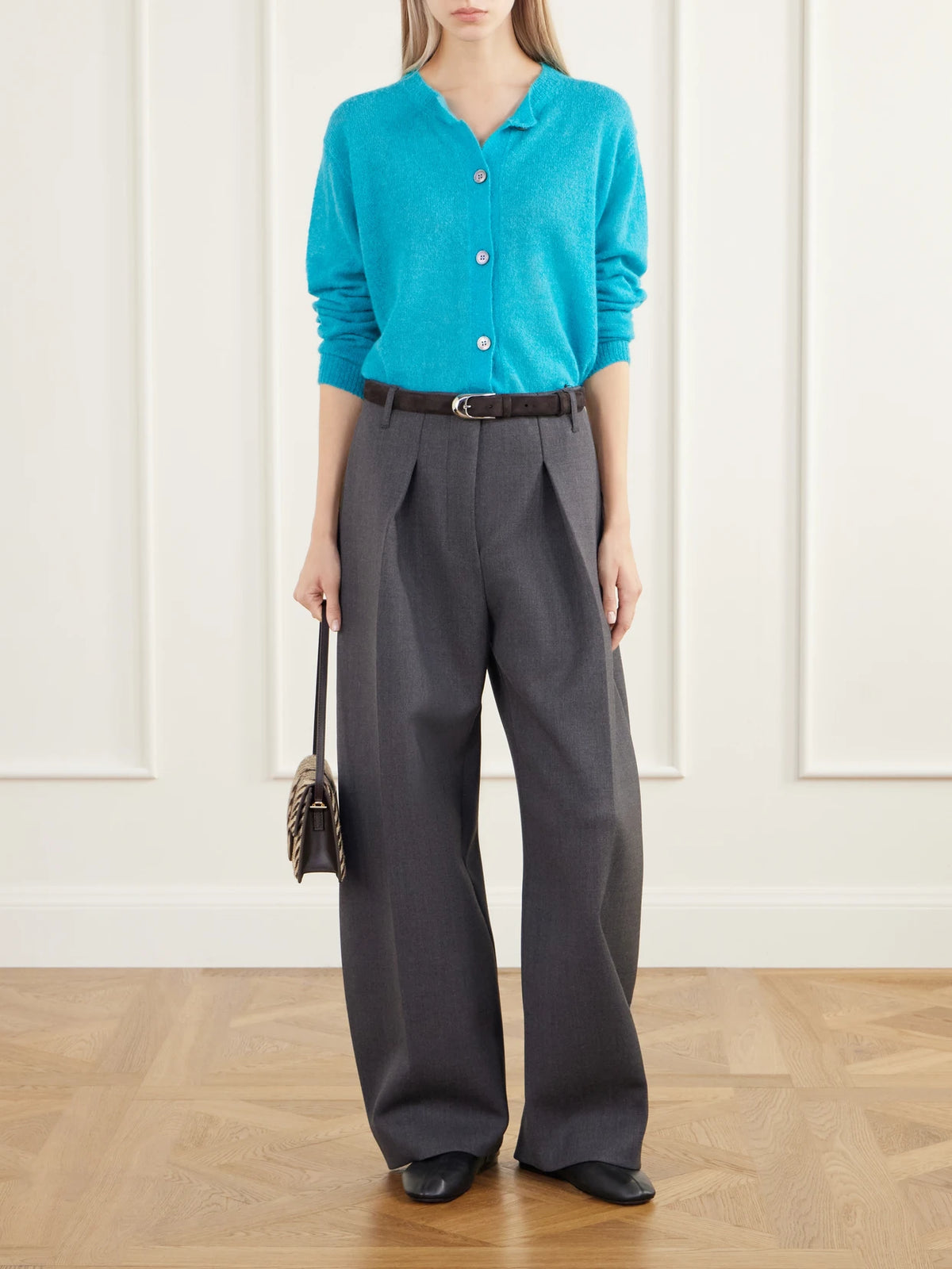 Image of a model wearing Pants. Product name - Le Pantalon Ovalo Pleated Stretch-crepe Barrel-leg Pants in Dark gray colour by brand - Jacquemus