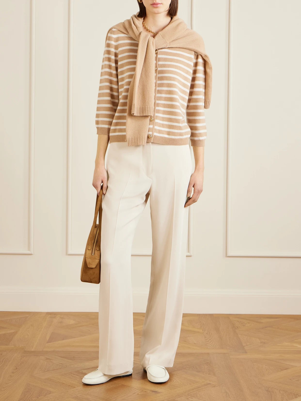 Image of a model wearing Outerwear. Product name - Striped Cashmere Cardigan in Beige colour by brand - Allude