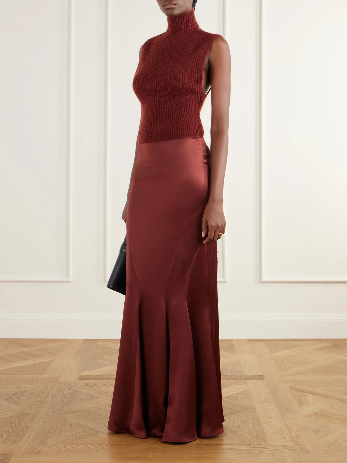 Image of a model wearing Outerwear. Product name - Placido Mohair-blend Turtleneck Sweater Vest in Burgundy colour by brand - Max Mara