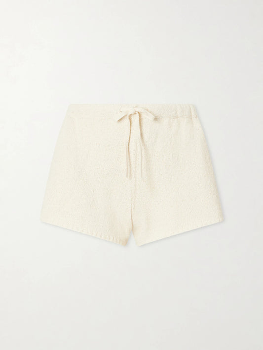 Image of a model wearing Shorts. Product name - Shallis Cotton-bouclé Shorts in Ecru colour by brand - Suzie Kondi