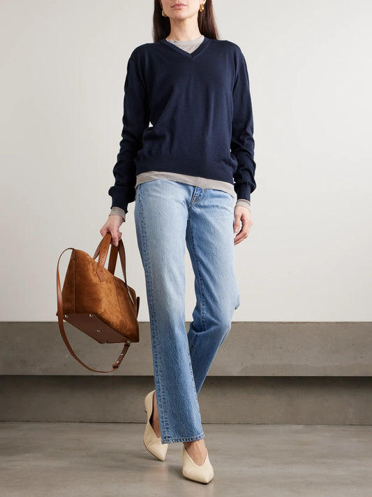 Image of a model wearing Outerwear. Product name - Oscar Embroidered Merino Wool Sweater in Navy colour by brand - RÙADH