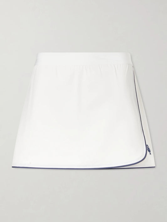 Image of a model wearing Tops. Product name - Anaya Jersey Skort in White colour by brand - Varley