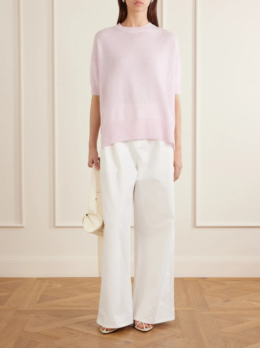 Image of a model wearing Outerwear. Product name - Cashmere Sweater in Pastel pink colour by brand - Jil Sander