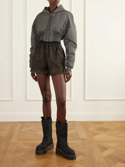 Image of a model wearing Shorts. Product name - Frayed Denim Shorts in Stone colour by brand - Rick Owens