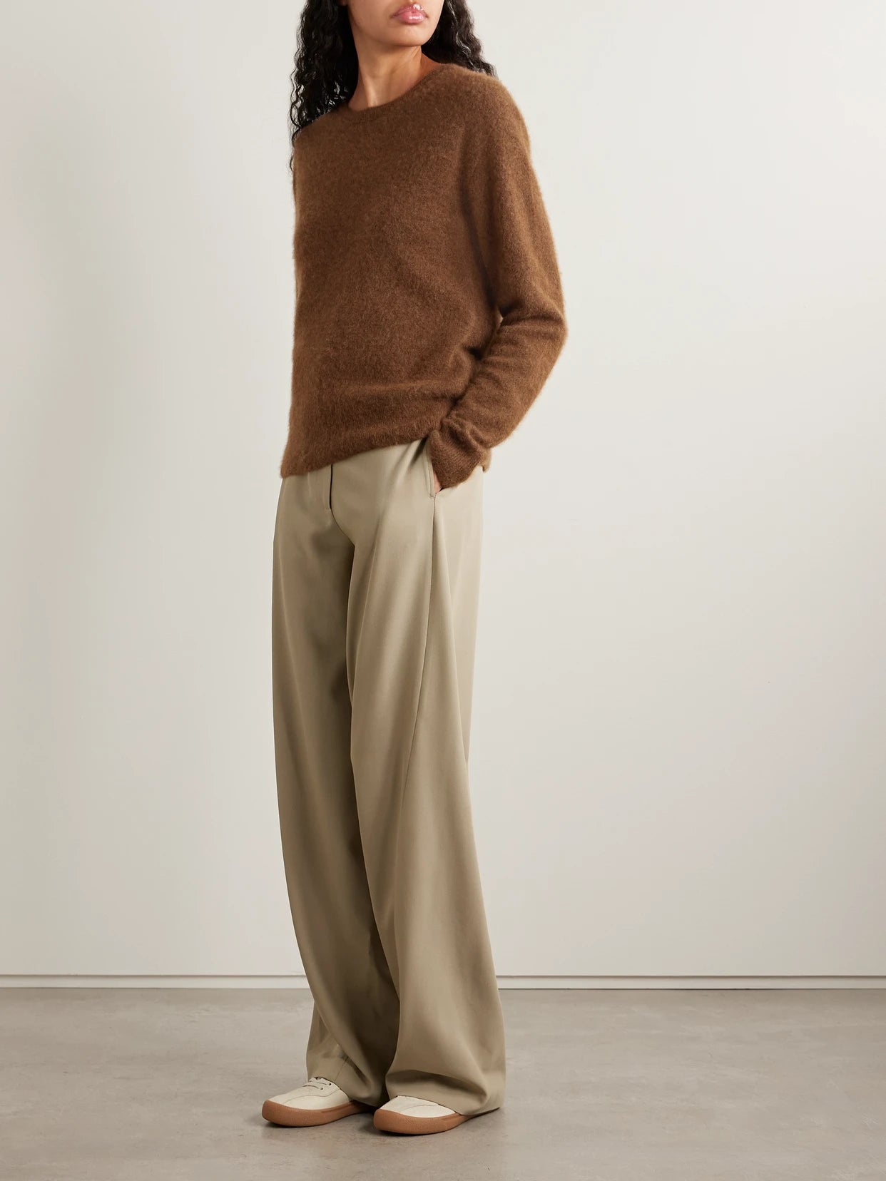 Image of a model wearing Outerwear. Product name - Lorynna Cashmere And Silk-blend Sweater in Light brown colour by brand - The Row