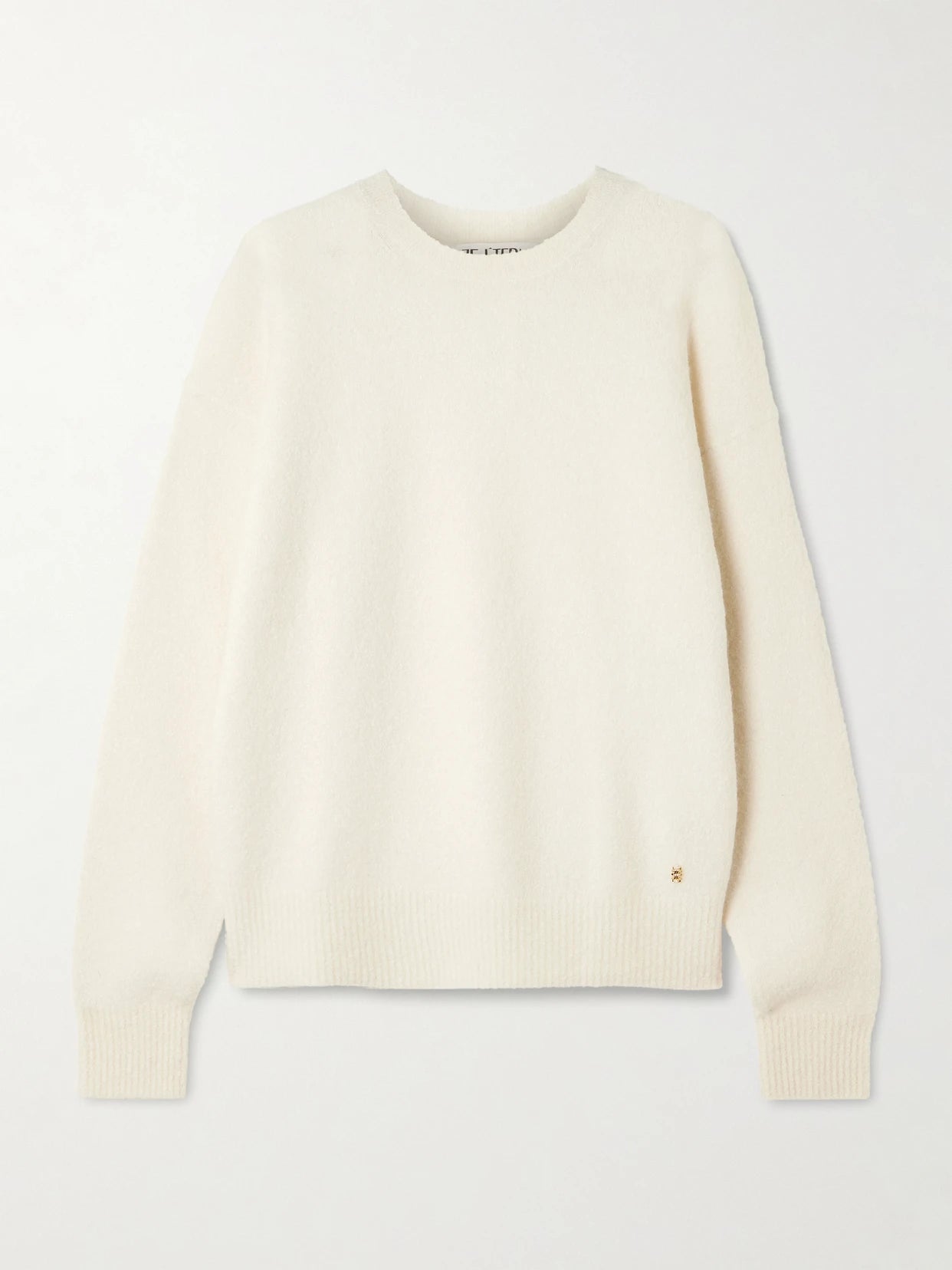 Image of a model wearing Outerwear. Product name - Brock Cashmere-blend Sweater in Cream colour by brand - ÉTERNE
