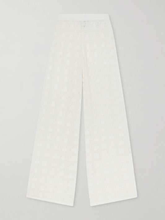 Image of a model wearing Pants. Product name - Egeo Pointelle-knit Wide-leg Pants in Ivory colour by brand - Loulou de Saison