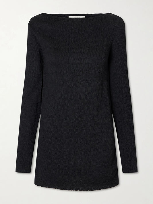 Image of a model wearing Outerwear. Product name - Ozma Pleated Silk Top in Black colour by brand - The Row