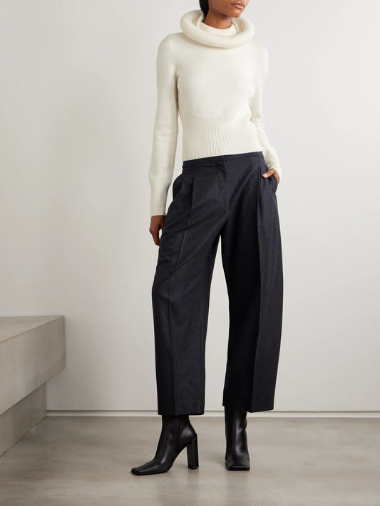 Image of a model wearing Outerwear. Product name - Wool Hooded Sweater in White colour by brand - Alaïa
