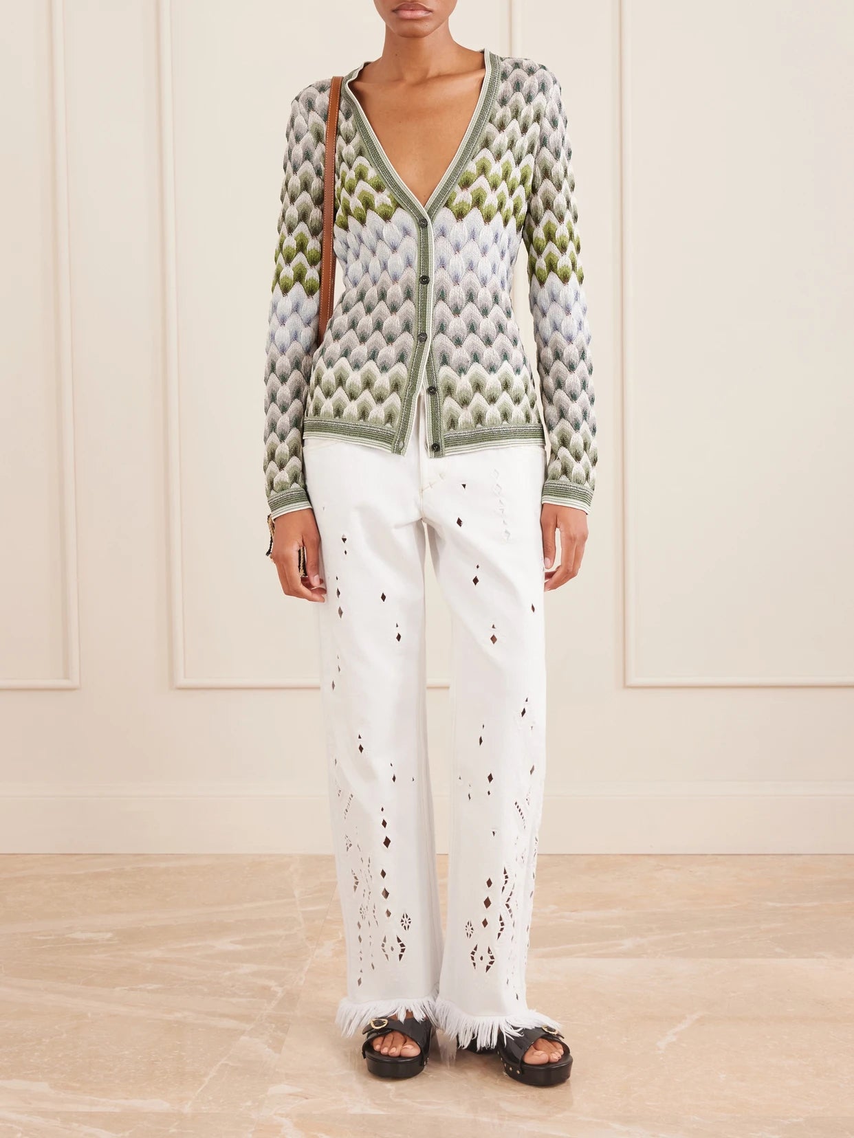 Image of a model wearing Outerwear. Product name - Striped Metallic Crochet-knit Cardigan in Multi colour by brand - Missoni