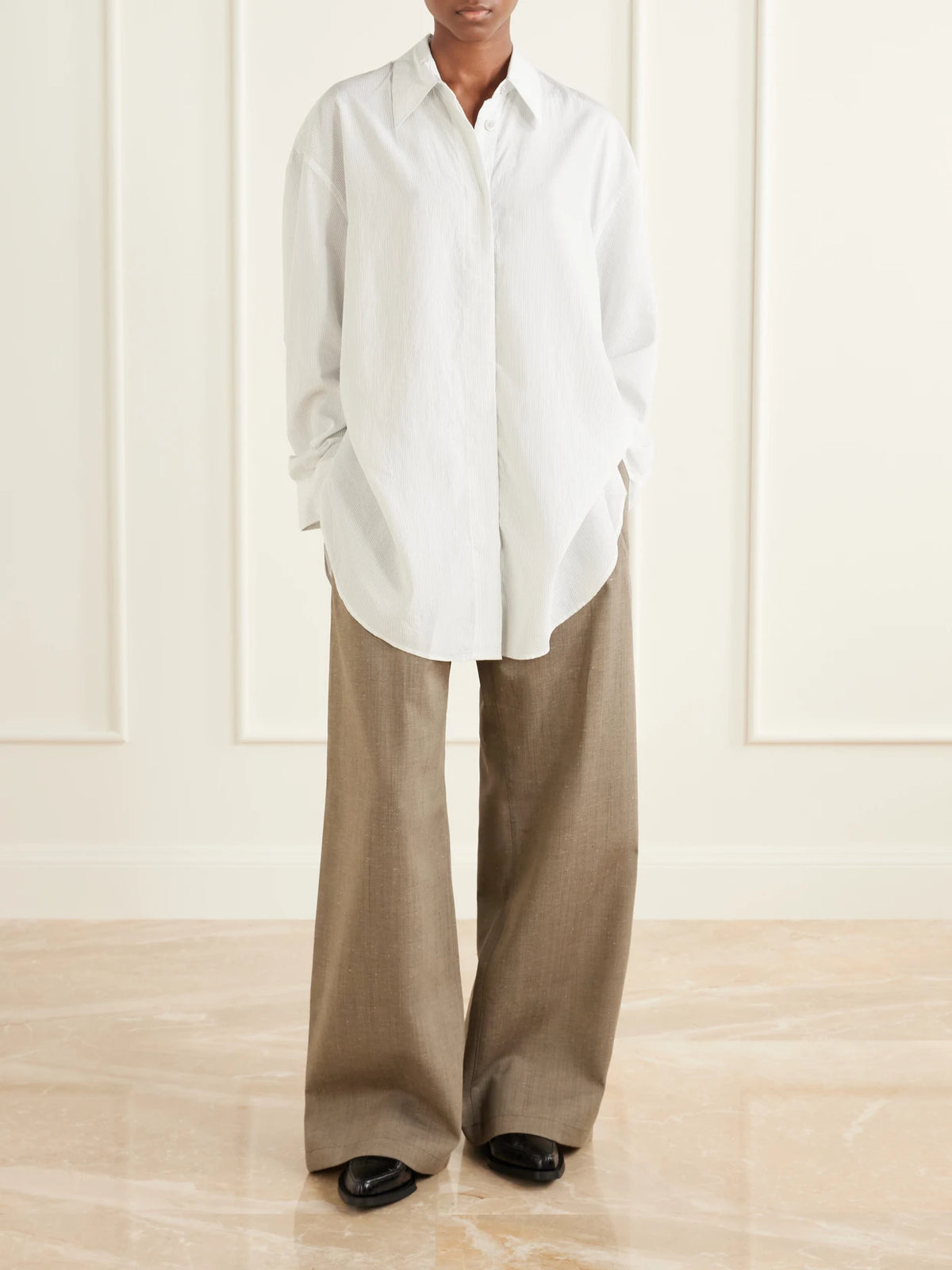 Image of a model wearing Pants. Product name - Wool-blend Wide-leg Pants in Beige colour by brand - Our Legacy
