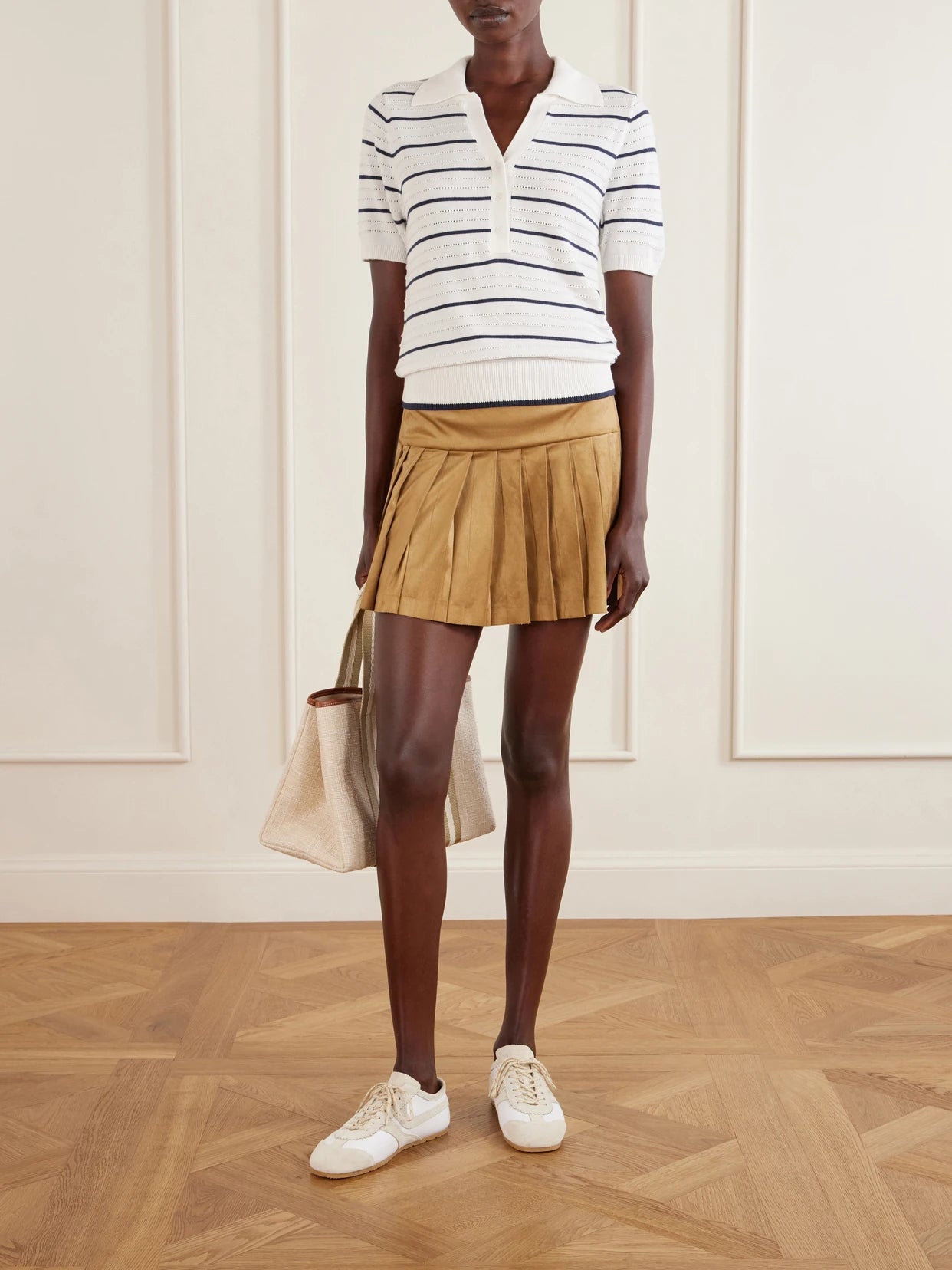 Image of a model wearing Outerwear. Product name - Wren Striped Cotton-blend Knitted Polo Shirt in White colour by brand - Varley