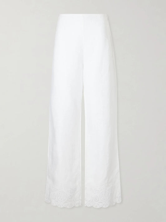 Image of a model wearing Pants. Product name - Oscar Embroidered Linen Straight-leg Pants in White colour by brand - STAUD
