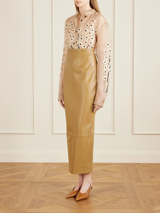 Image of a model wearing Tops. Product name - Appliquéd Embroidered Silk-organza Shirt in Beige colour by brand - KHAITE
