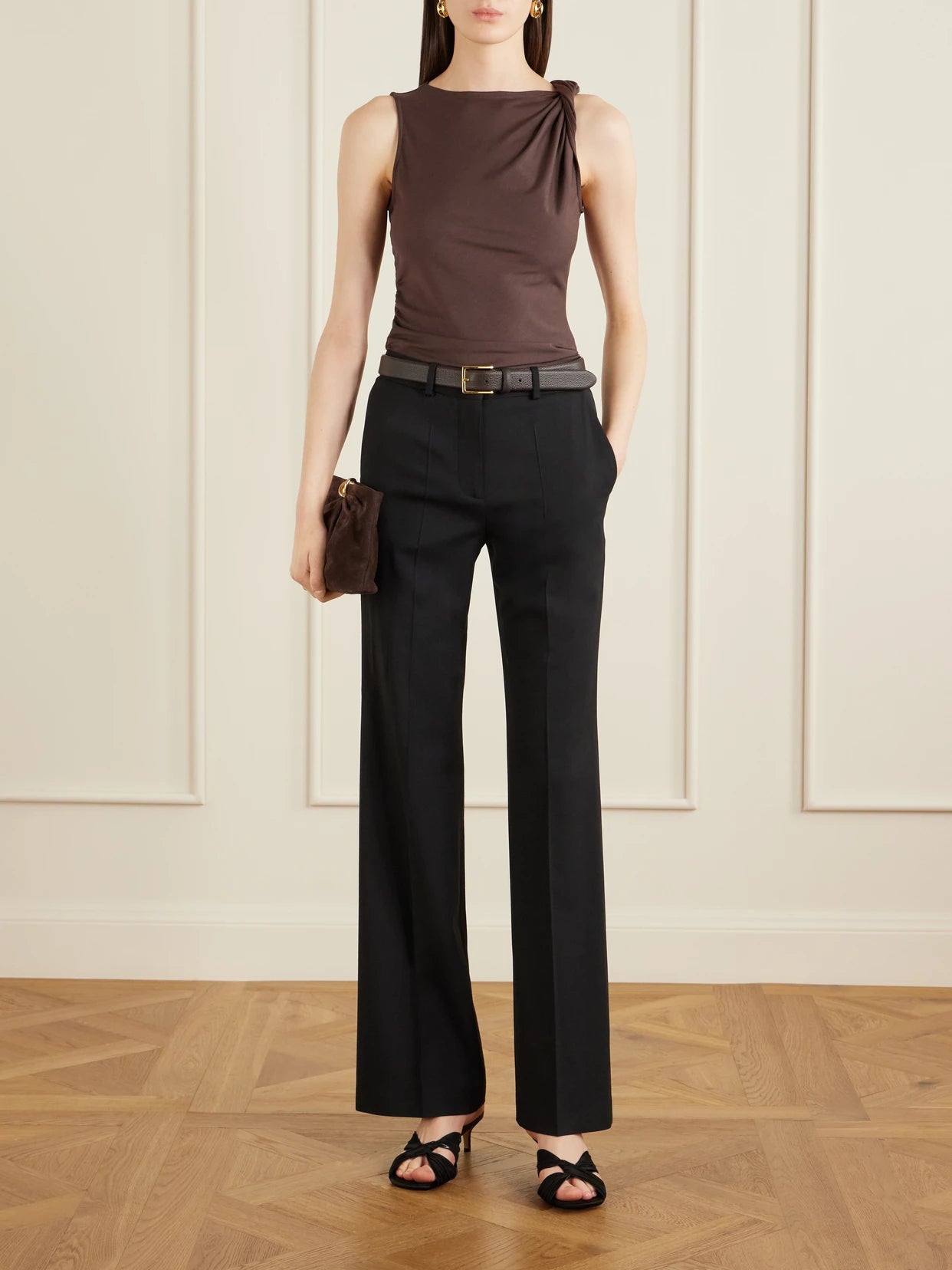 Image of a model wearing Tops. Product name - Otessa Twisted Lyocell-blend Jersey Top in Dark brown colour by brand - Veronica Beard
