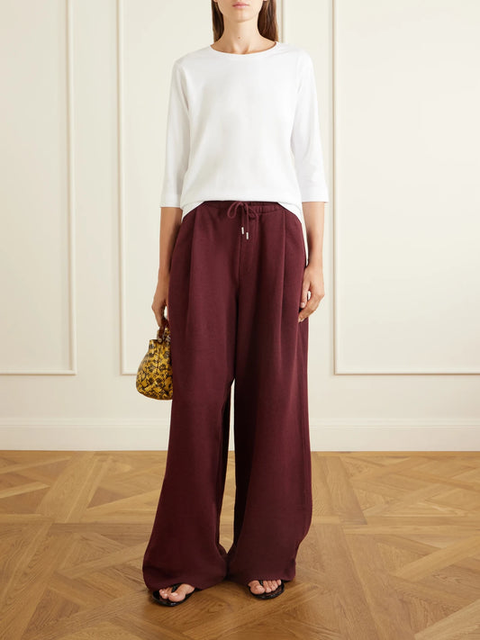 Image of a model wearing Tops. Product name - Cotton T-shirt in White colour by brand - Dries Van Noten