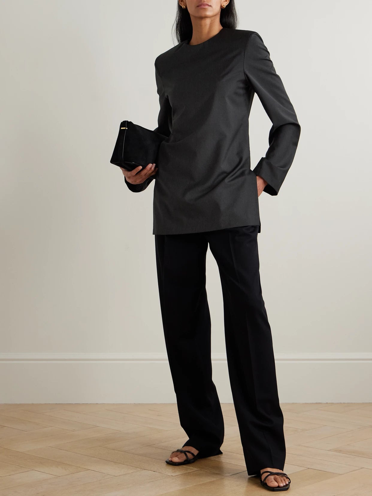 Image of a model wearing Tops. Product name - Wool Blouse in Charcoal colour by brand - TOTEME