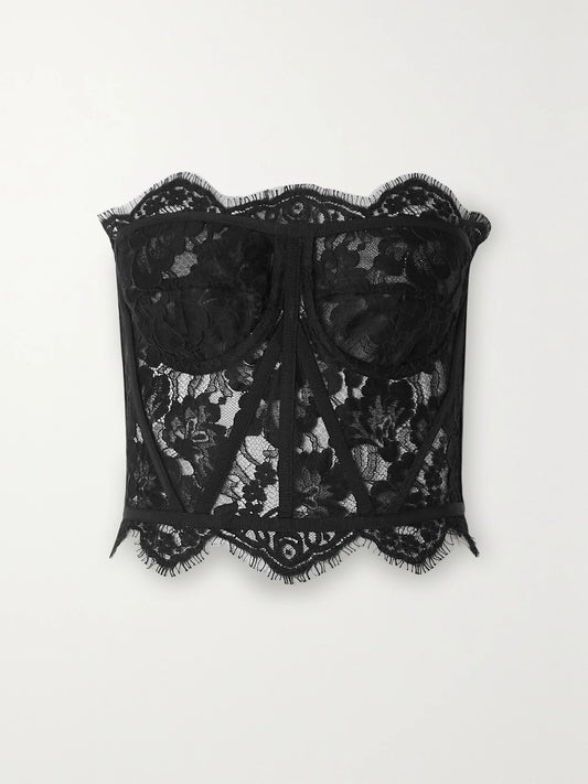 Image of a model wearing Tops. Product name - Grosgrain-trimmed Lace Bustier Top in Black colour by brand - Dolce & Gabbana
