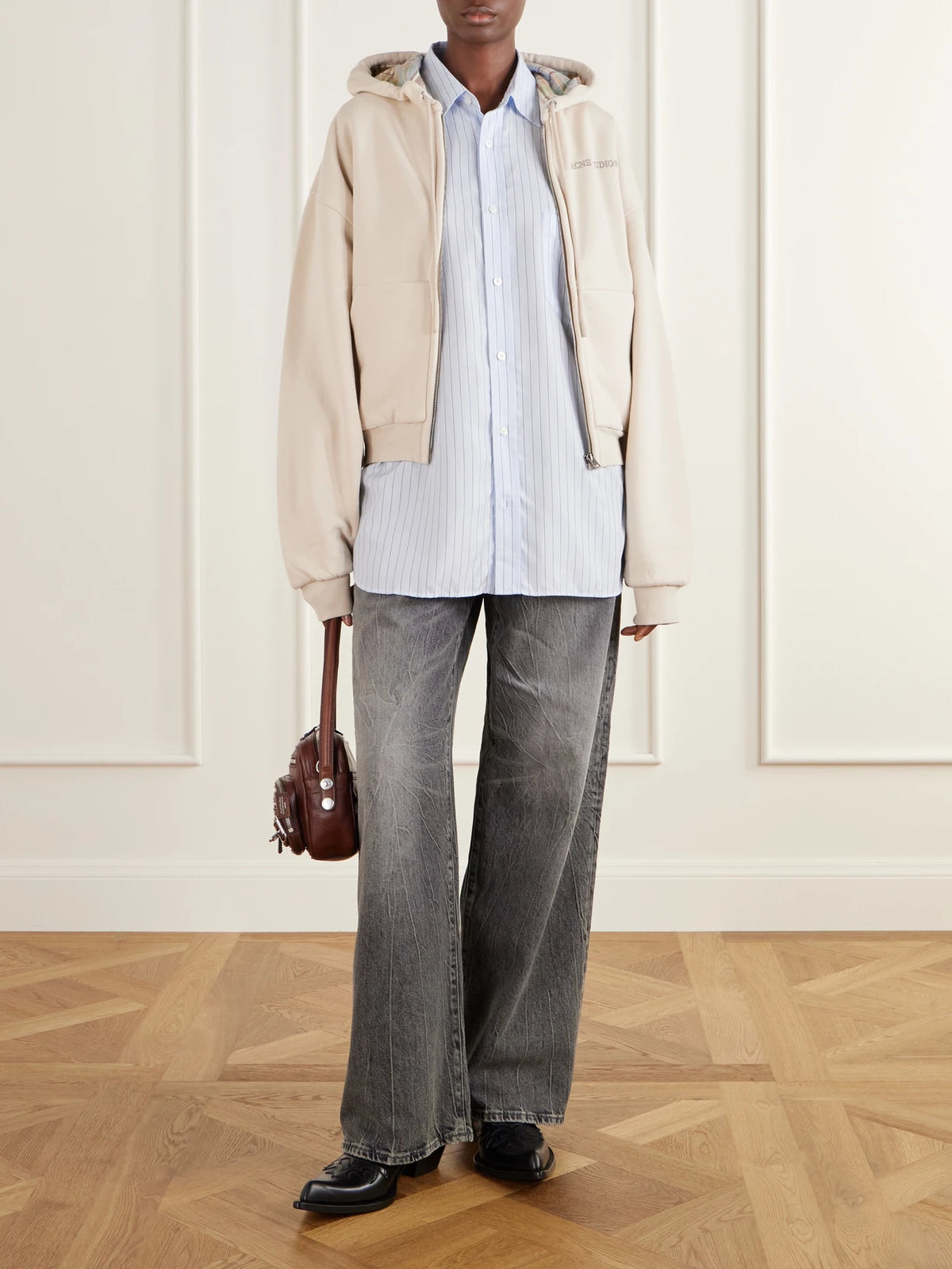Image of a model wearing Tops. Product name - Embroidered Cotton Zip-up Hoodie in Beige colour by brand - Acne Studios