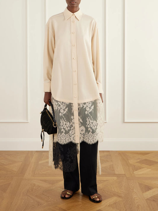 Image of a model wearing Tops. Product name - Valiant Asymmetric Lace-trimmed Stretch-wool Shirt in Cream colour by brand - Zimmermann