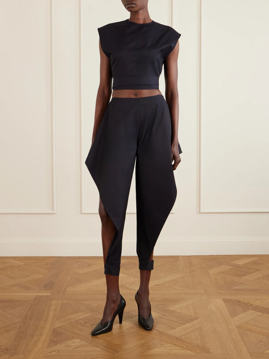 Image of a model wearing Tops. Product name - Belted Cropped Cotton-gabardine Top in Navy colour by brand - Alaïa