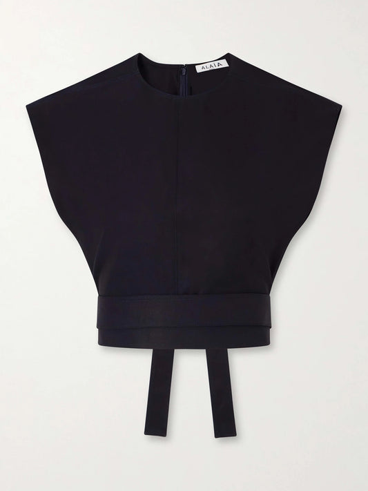 Image of a model wearing Tops. Product name - Belted Cropped Cotton-gabardine Top in Navy colour by brand - Alaïa