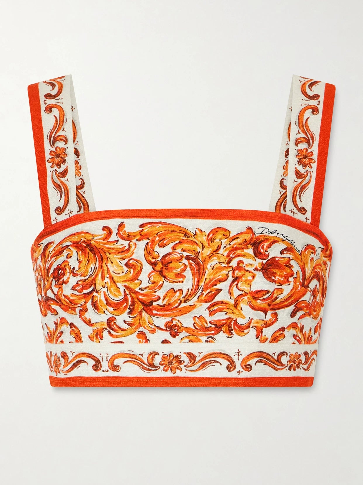 Image of a model wearing Tops. Product name - Cropped Printed Woven Top in Orange colour by brand - Dolce & Gabbana