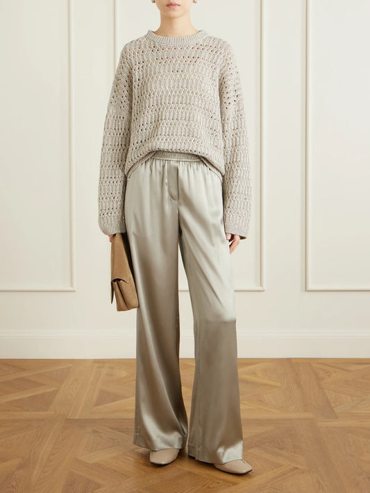 Image of a model wearing Pants. Product name - Silk-blend Satin Wide-leg Pants in Rose gold colour by brand - Brunello Cucinelli