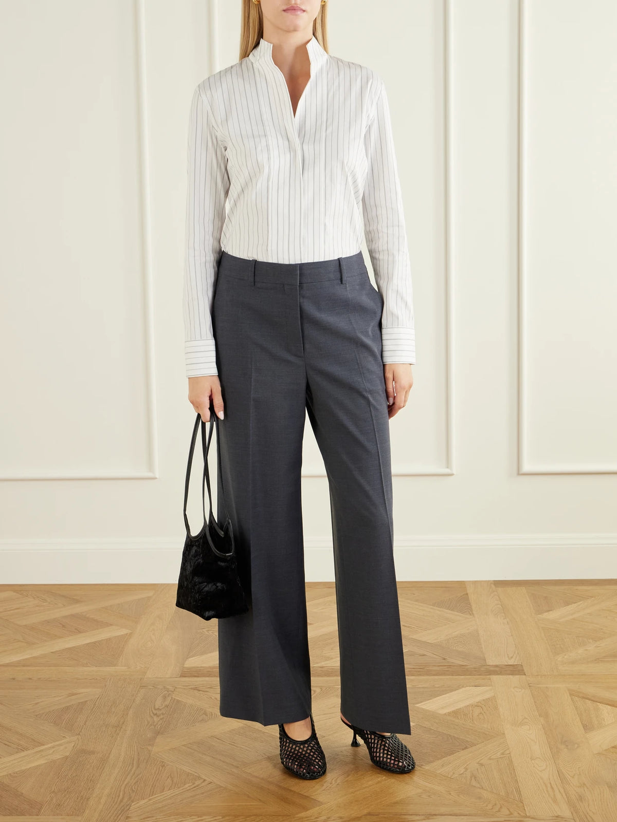 Image of a model wearing Pants. Product name - Stretch-wool Straight-leg Pants in Gray colour by brand - Theory
