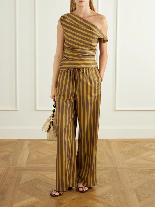 Image of a model wearing Tops. Product name - Phare Striped Cotton-blend Poplin Blouse in Brown colour by brand - STAUD