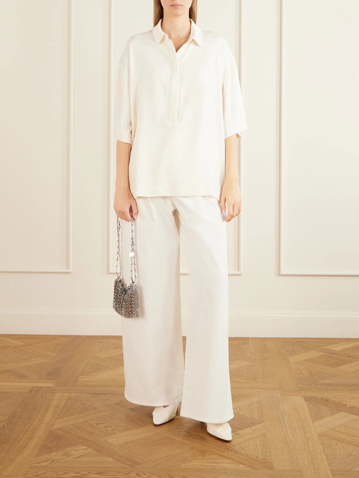 Image of a model wearing Tops. Product name - Eda Cady Polo Shirt in Ivory colour by brand - The Frankie Shop