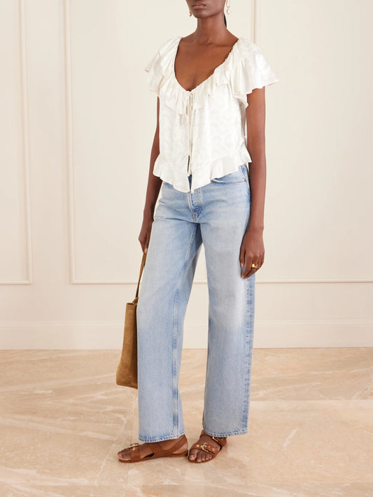 Image of a model wearing Tops. Product name - Floriette Ruffled Satin-jacquard Blouse in White colour by brand - DÔEN