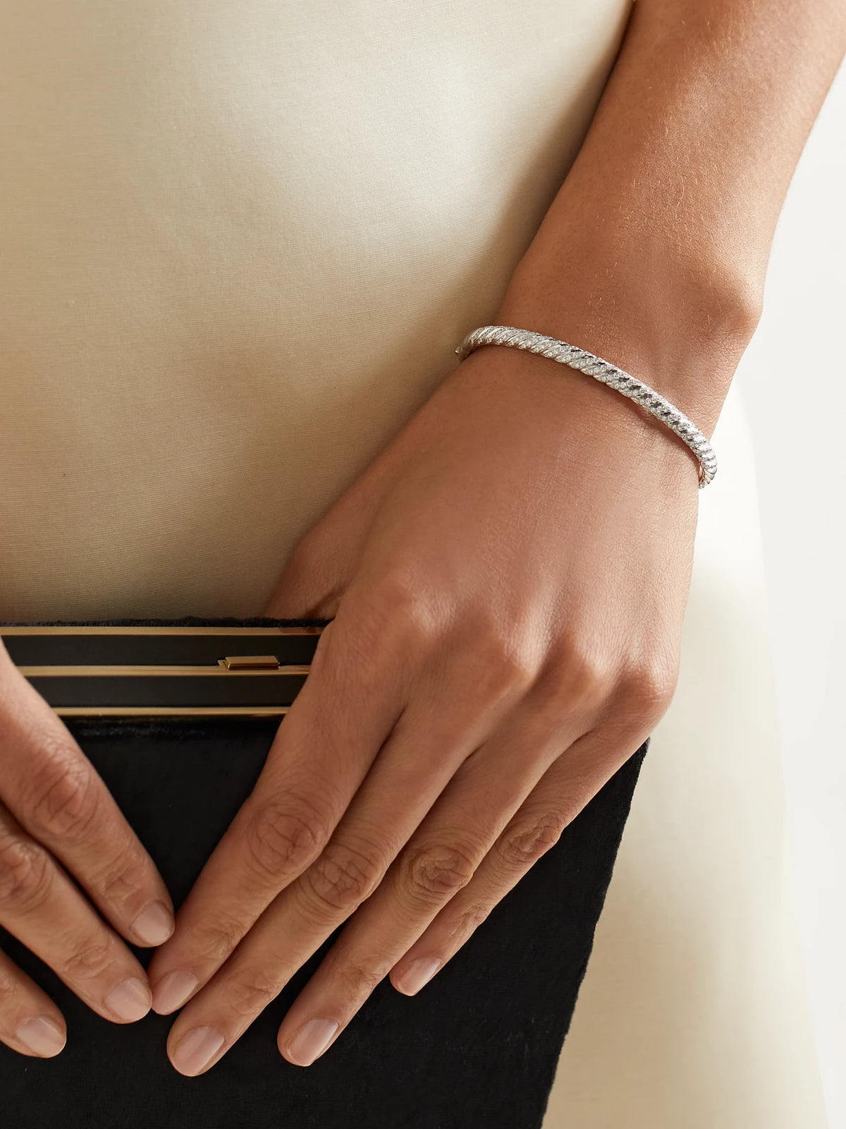 Image of Bracelets. Product name - Sculpted Cable 18-karat White Gold Diamond Bangle in Multi colour by brand - David Yurman
