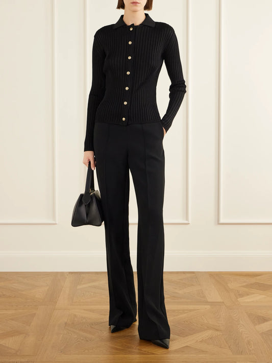 Image of a model wearing Outerwear. Product name - Ribbed Cardigan in Black colour by brand - Balmain