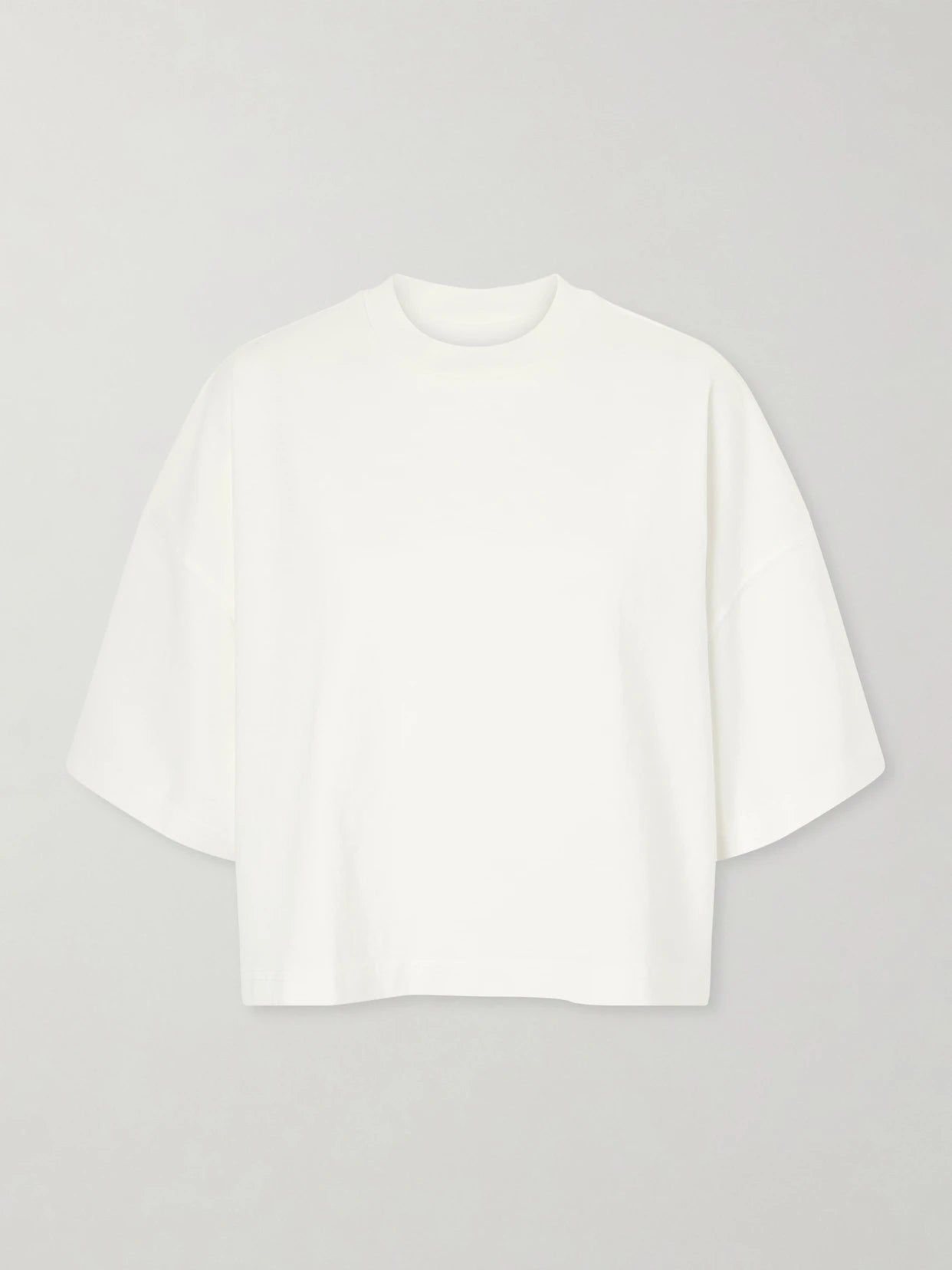 Image of a model wearing Tops. Product name - Box Cotton-jersey T-shirt in White colour by brand - SLVRLAKE
