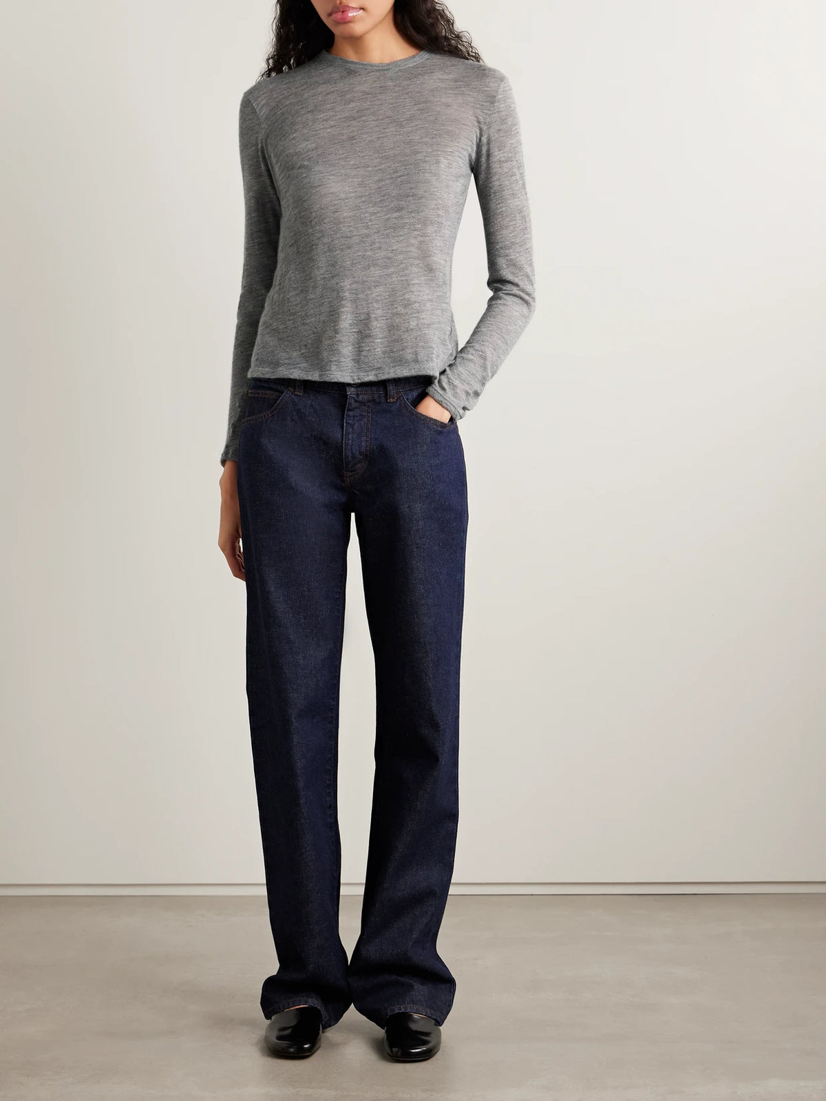 Image of a model wearing Tops. Product name - Iverness Cashmere Top in Gray colour by brand - The Row
