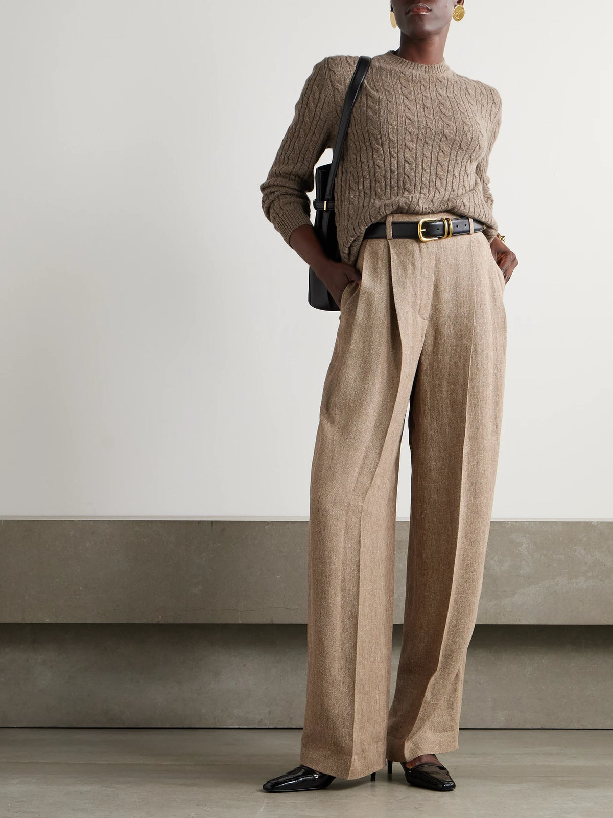 Image of a model wearing Outerwear. Product name - Cable-knit Cashmere Sweater in Brown colour by brand - Loro Piana