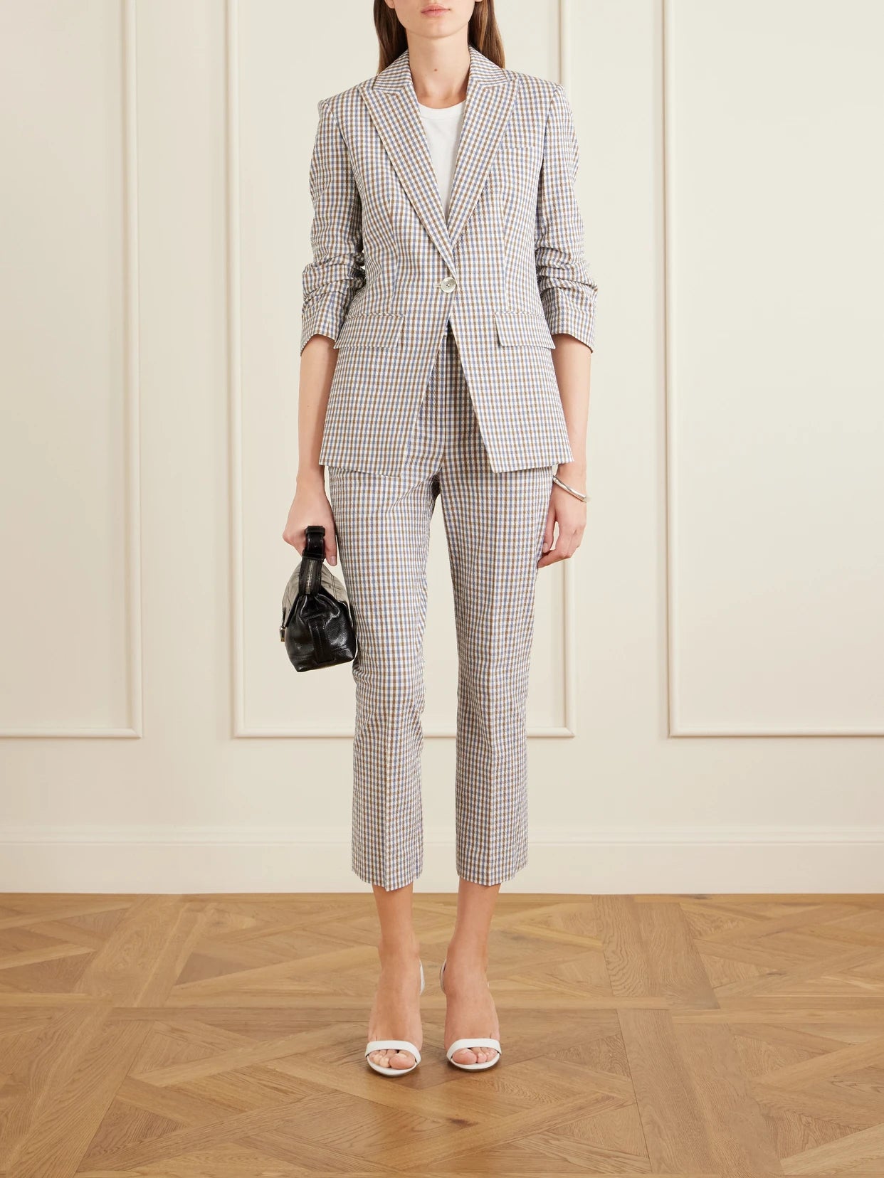 Image of a model wearing Pants. Product name - Arte Checked Cotton-seersucker Skinny Pants in Blue colour by brand - Veronica Beard