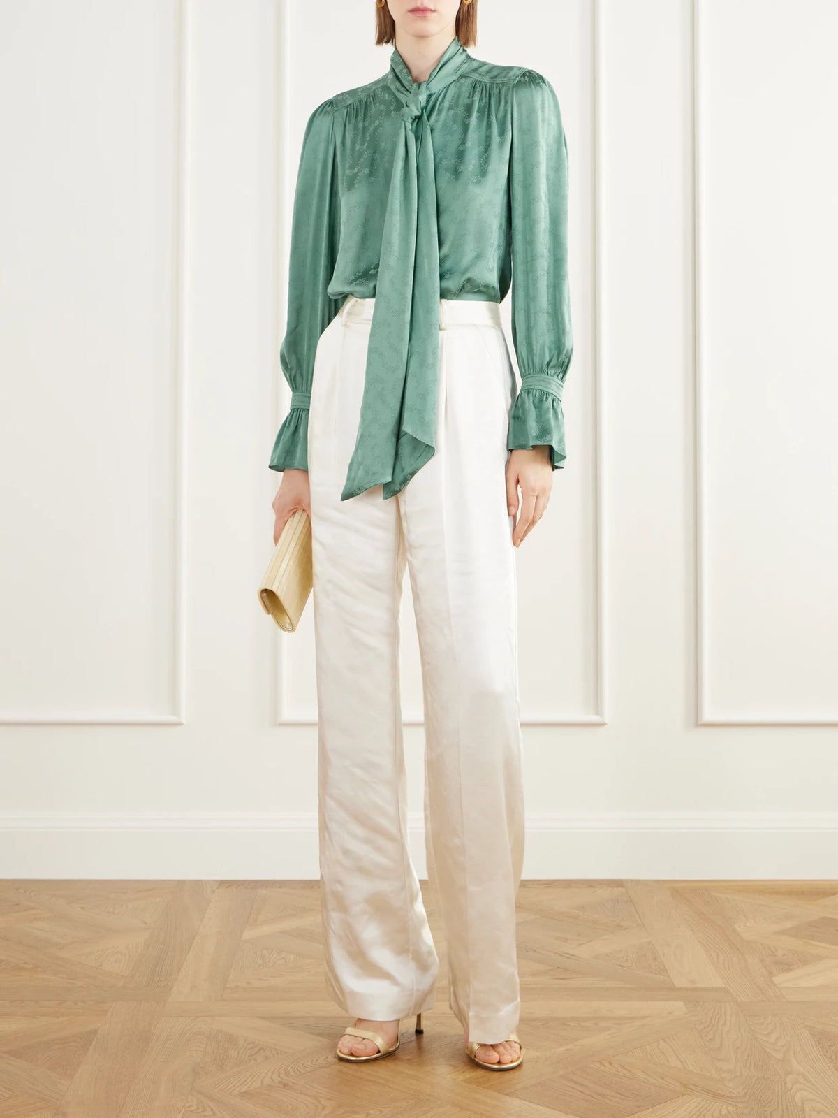 Image of a model wearing Tops. Product name - Evanora Pussy-bow Gathered Floral-jacquard Satin Blouse in Green colour by brand - RIXO