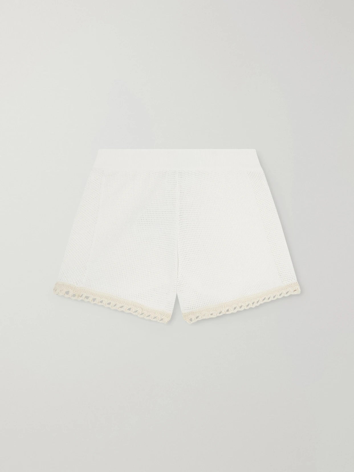 Image of a model wearing Shorts. Product name - Crochet-trimmed Cotton Shorts in White colour by brand - Stella McCartney