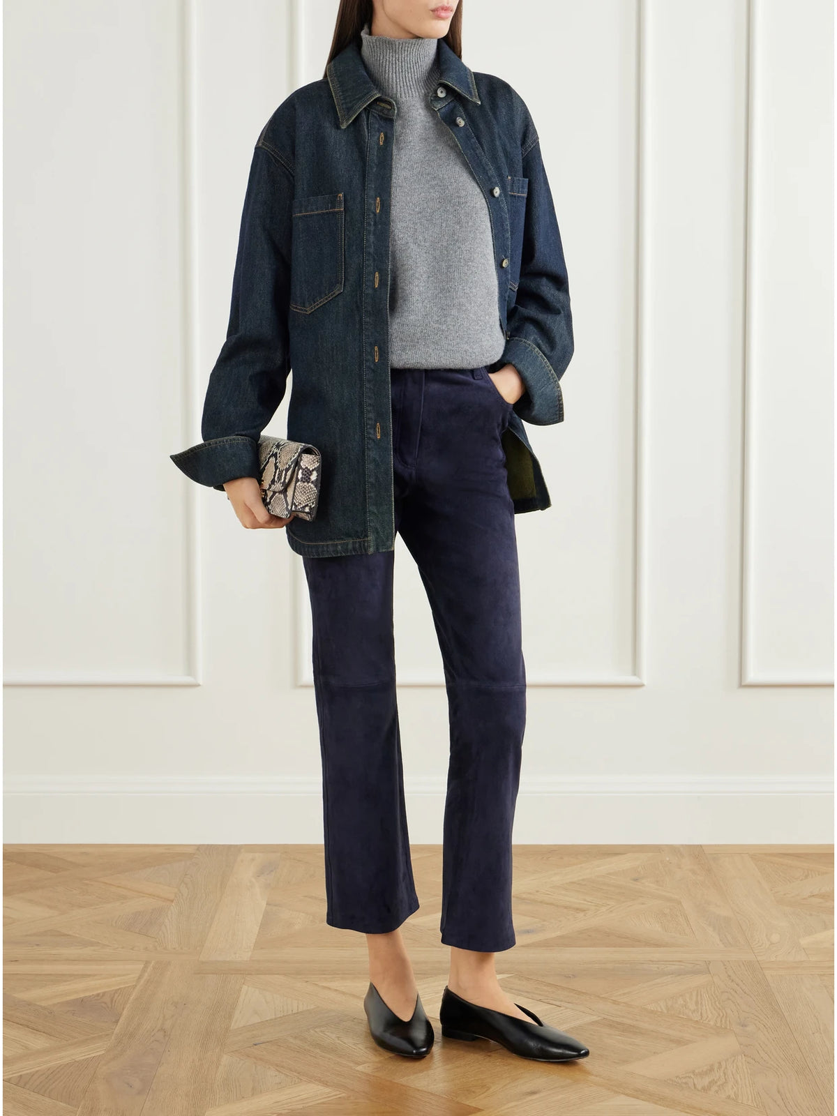 Image of a model wearing Pants. Product name - Duke Suede Flared Pants in Navy colour by brand - Joseph