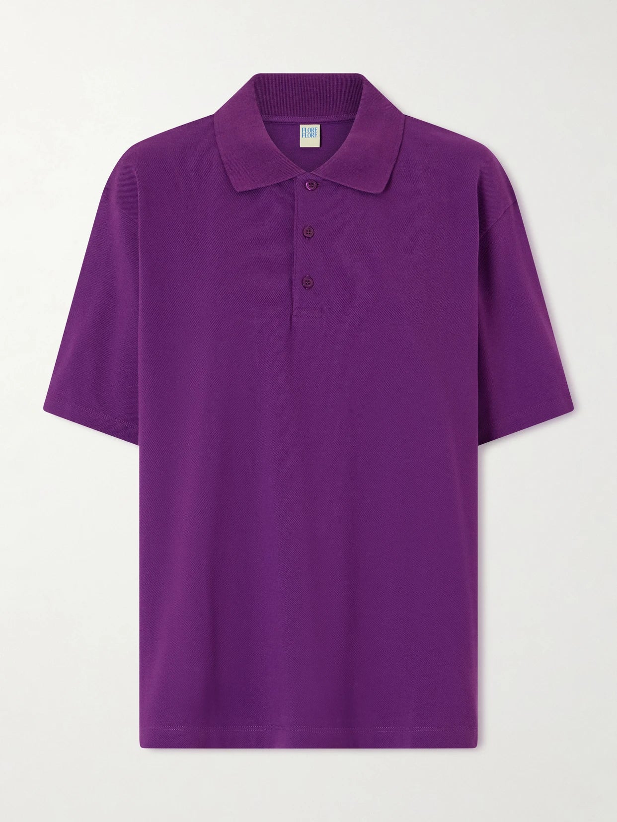 Image of a model wearing Tops. Product name - Julie Organic Cotton-piqué Polo Shirt in Purple colour by brand - FLORE FLORE