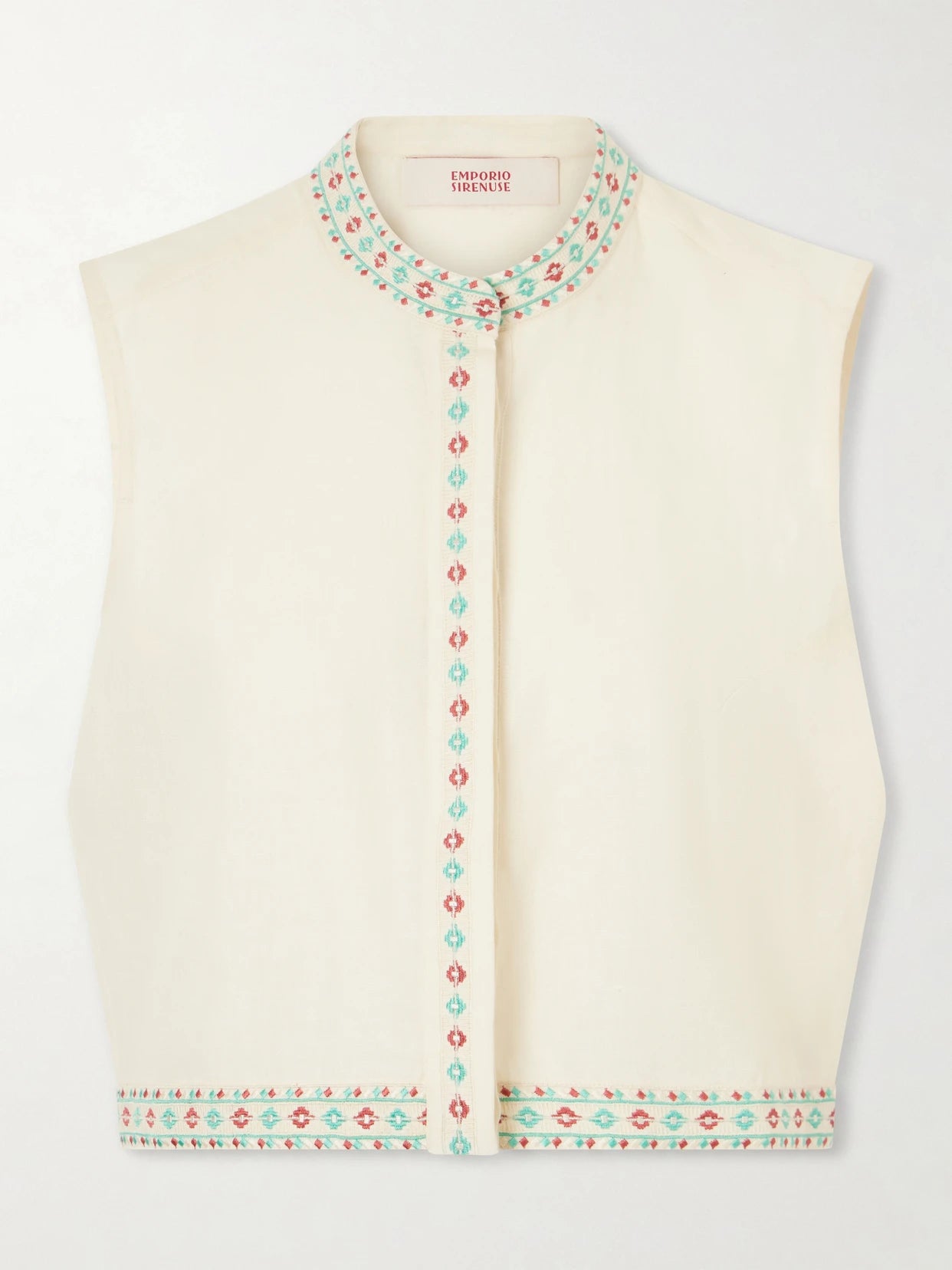 Image of a model wearing Tops. Product name - Andorra Astragal Mare Embroidered Linen And Cotton-blend Top in Cream colour by brand - Emporio Sirenuse